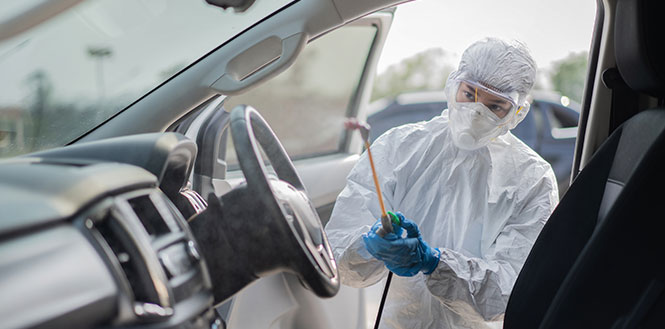 disinfecting a car