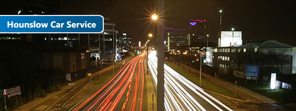 hounslow taxi service busy street at night with fast traffic